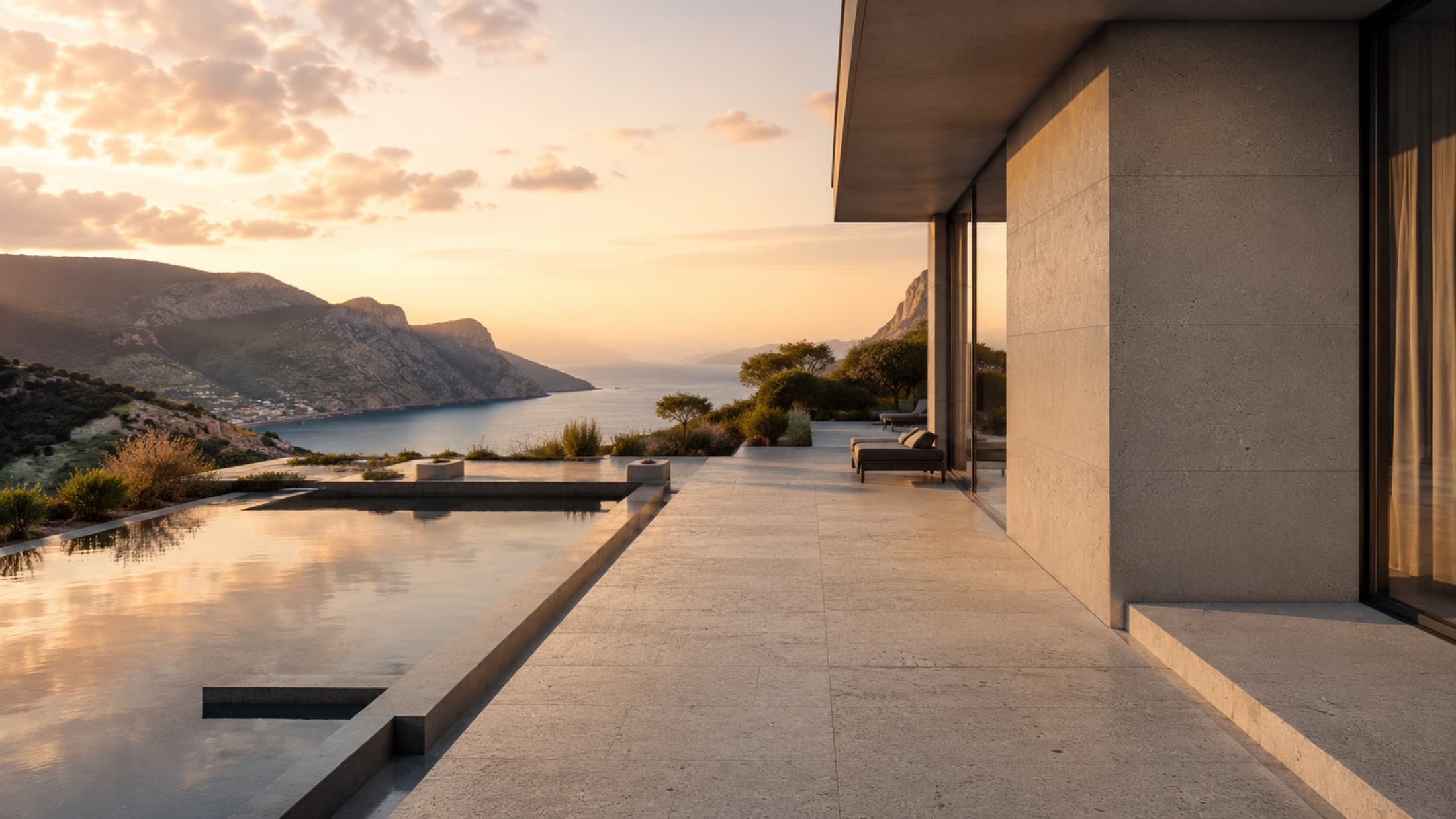 A hillside villa clad in Parseh volcanic stone at dusk